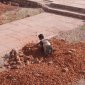 33 Orchha A young girl working to break stones.jpg